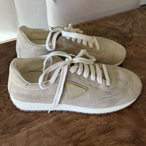 Prada Cream Suede Low-Top Sneakers with Gold Triangle Logo